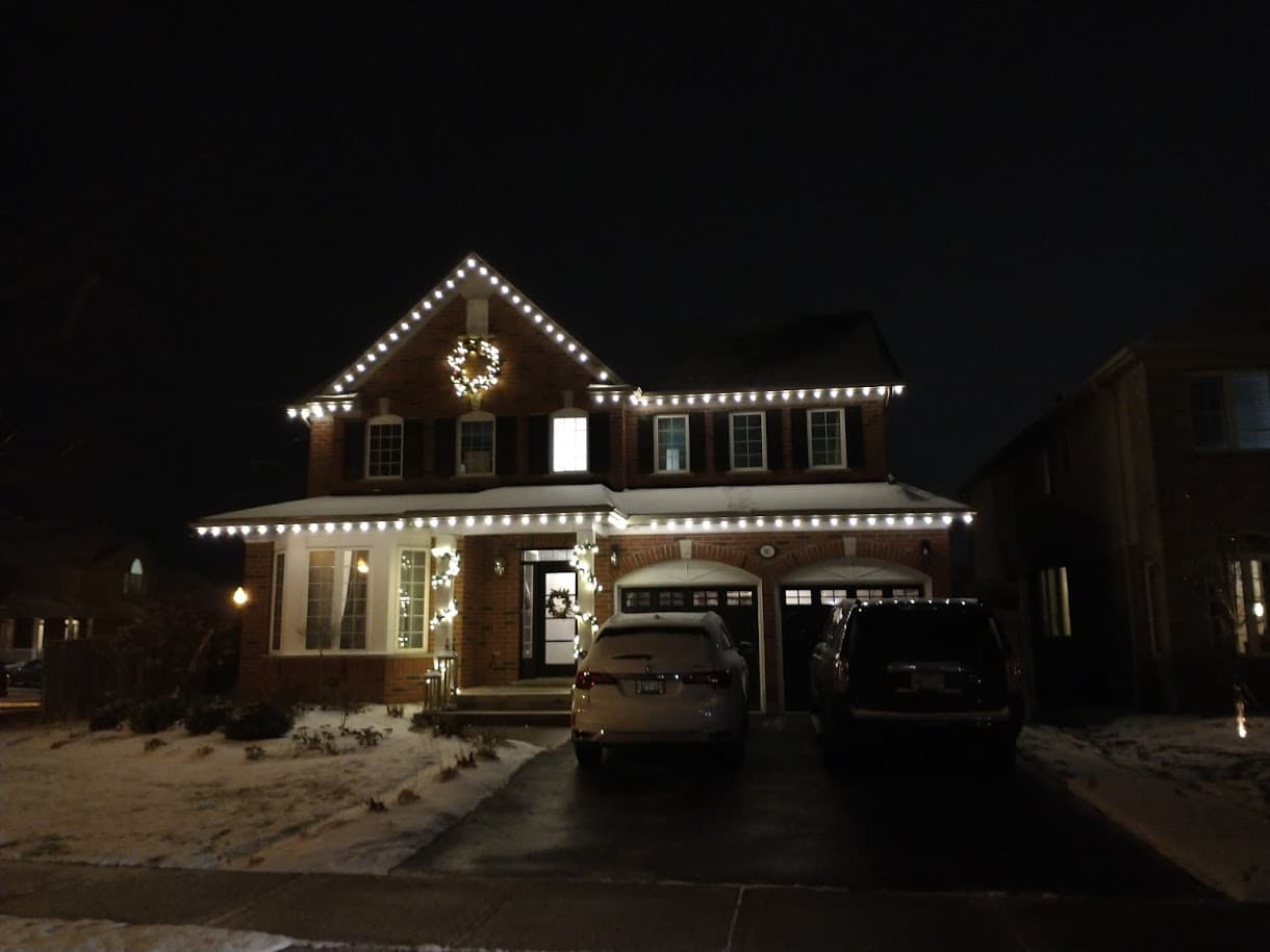 Designer reviewing a custom Christmas lighting plan